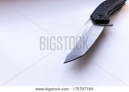 The blade of the knife. Gray background. Diagonal.