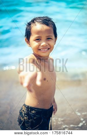 Happy portrait of one little girl on the beach