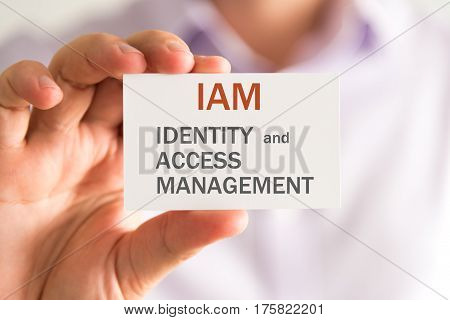 Businessman Holding A Card With Iam Identity And Access Management Message