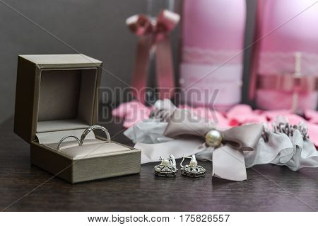 Engagement ring box in bride hands. Closeup of woman palms holding jewellery. Love, Wedding, Proposing, Marriage concept. Rustic chic style