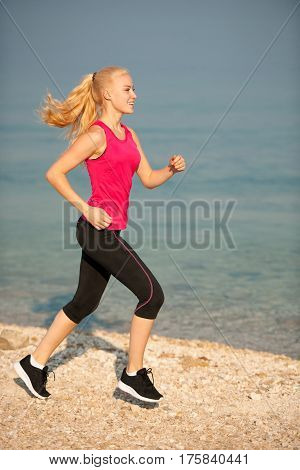 Jogging In Th Beach - Woman Runns Near Sea On Early Summer Morning