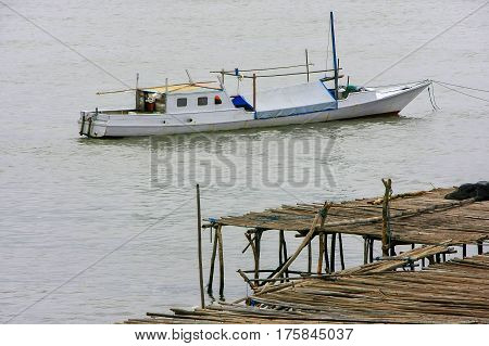 Traditional boat anchored at Labuan Bajo town on Flores Island Nusa Tenggara Indonesia. The local economy in the town is centered around the ferry port and tourism.
