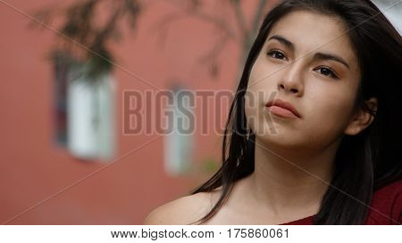 Serious and Unemotional Hispanic Young Teen Girl