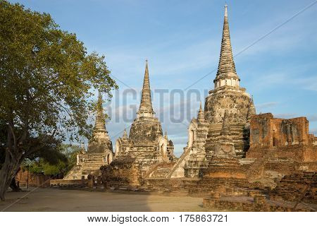 The ancient stupas of the buddhist temple of Wat Phra Si Sanphet on a sunny morning. Ayutthaya, Thailand