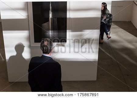 MILAN ITALY - MARCH 10: People visit MIA international photography and moving image art fair on MARCH 10 2017 in Milan.