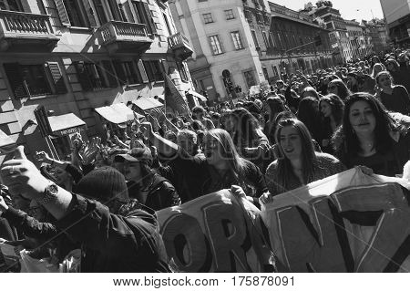 MILAN ITALY - MARCH 8: Secondary school students take part in a march to celebrate the International Women's Day on MARCH 8 2017 in Milan.