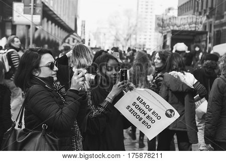 MILAN ITALY - MARCH 8: Secondary school students take part in a march to celebrate the International Women's Day on MARCH 8 2017 in Milan.