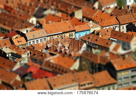 Rooftop tilt shift view of a European city. Brasov Transylvania Romania