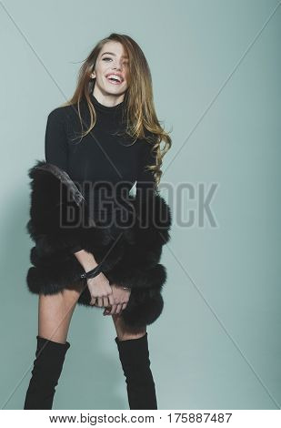 Pretty Sexy Woman With Long Hair In Fur And Jackboot