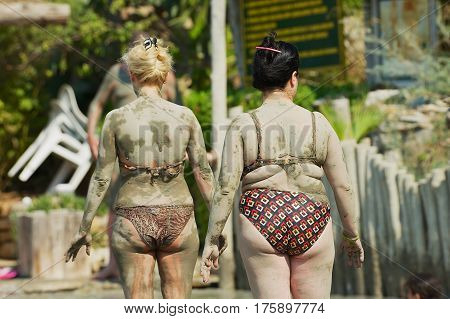 DALYAN, TURKEY - AUGUST 13, 2009: Unidentified women dry after taking mud bath in Dalyan, Turkey.