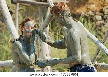 DALYAN, TURKEY - AUGUST 13, 2009: Unidentified people take mud bath in Dalyan, Turkey.
