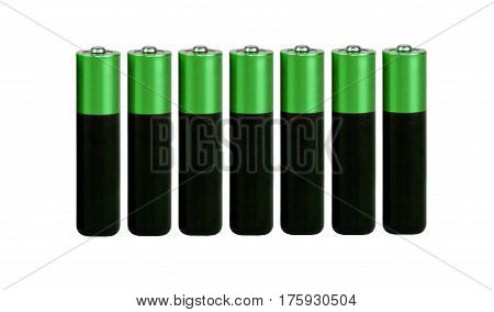 Seven batteries of the type AAA on a white background, isolated