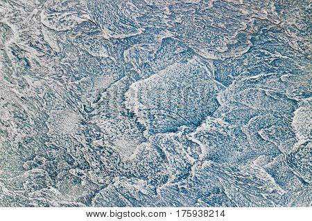 Texture of blue - sea wave. Decorative plaster background on the wall