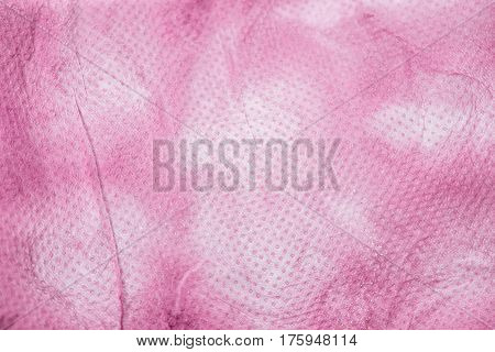 Pink nonwoven fabric texture background. Nonwoven texture