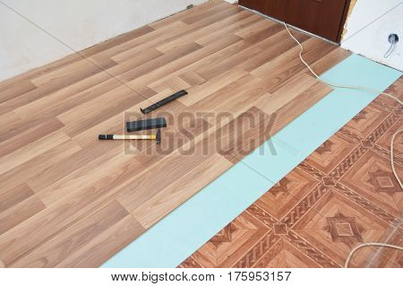 Installing laminate flooring. Laminate flooring installation interior.