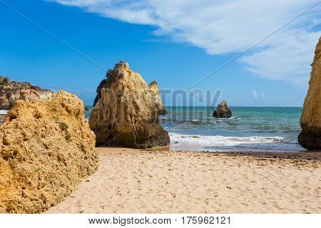 Rocky cliffs on the coast of the Atlantic ocean in Lagos Algarve Portugal