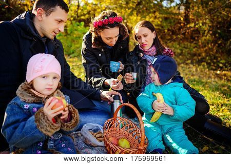 Girl Sitting On The Grass With An Apple In His Hand