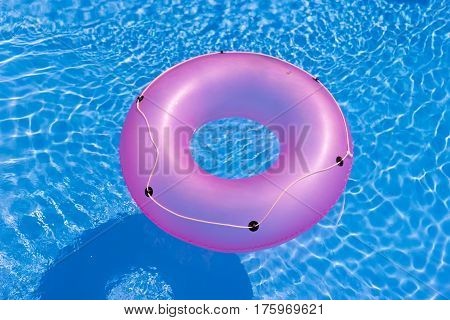 Rubber ring in the swimming pool  with clear water
