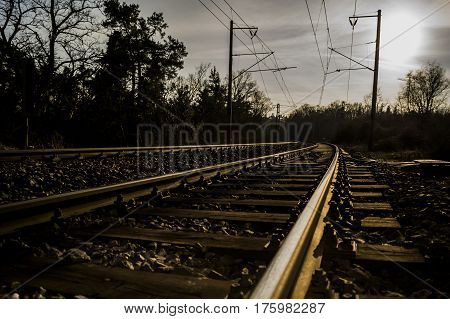 rail curved track with wooden sleepers electric lines and no train