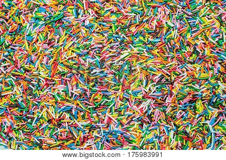 Sugar sprinkle dots, decoration for cake and bekery, a lot of sprinkles as a background.