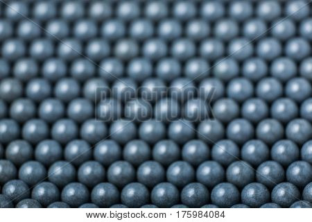 Blurred Background Of Grey Airsoft Balls Of 6Mm