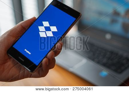 Chiang Mai, Thailand - July 14,2018: Woman Holding Huawei With Dropbox On Screen. Dropbox Is A Servi