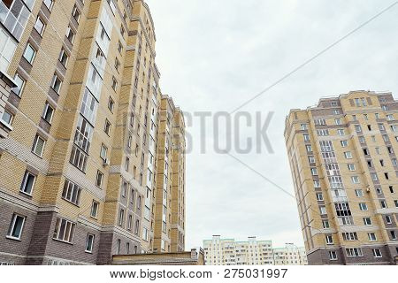 Modern Condominium Building Real Etate In City With Blue Sky.