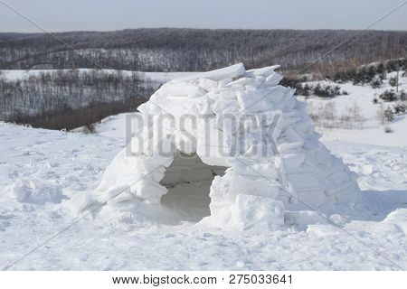 A Small Ice House-igloo On The Background Of A Beautiful Winter Landscape
