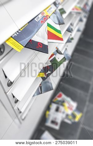 Modern Metal Mail Boxes, Overfull Of Leaflets; Some Have Fallen On The Ground. Ideal For Concepts. S