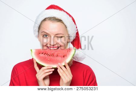 Christmas Girl Eat Watermelon. Woman Santa Hat Hold Slice Watermelon. Prolong Summer. Travel Christm