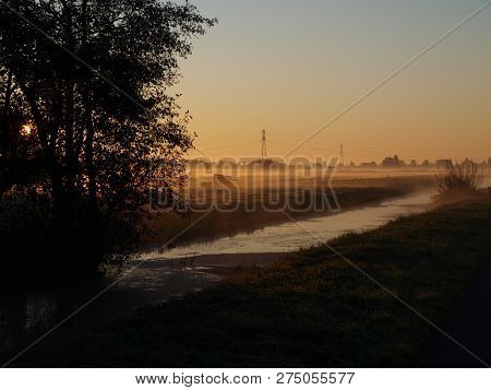 Sunrise With Morning Fog Over The Meadows Of The Polder At Goudarak Close To Gouda In The Netherland