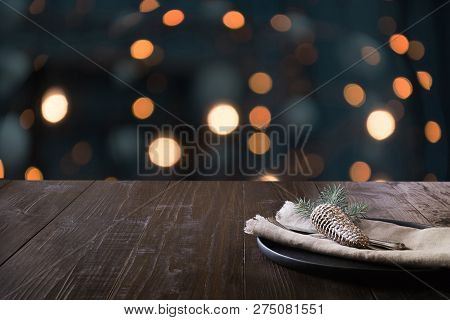 Christmas Table Setting And Blurred Kitchen As Bachground. Space For Montage Your Christmas Products