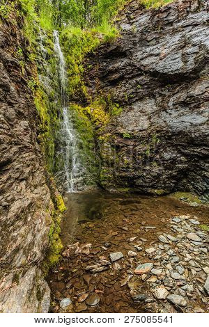 Little Waterfall In Green Summer Mountains, Norway.