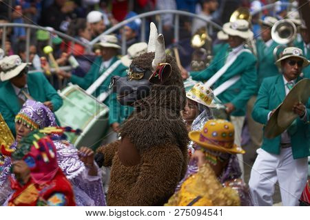 Oruro, Bolivia - February 25, 2017: Members Of A Waca Waca Dance Group In Ornate Costume Parade Thro