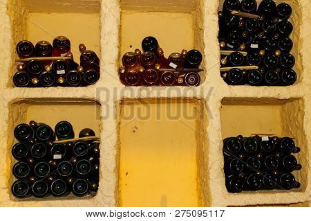 Many Champagne Bottles In A Wine Cellar