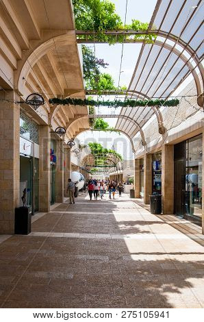 Jerusalem, Israel - May 25, 2012: Locals And Tourists Walking By The Famous Mamilla Street Full Of S