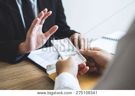 Anti Bribery And Corruption Concept, Business Man Refusing And Don't Receive Money Banknote Offered 