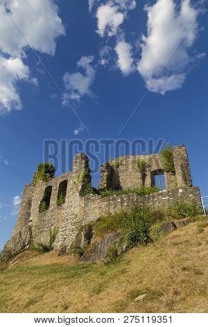 Ruins Of Castle Koenigstein (konigstein) . Wall With Empty Windows Against The Blue Cloudy Sky. Anci