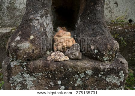 Nagasaki, Japan - October 22, 2018: Traditional stone sculpture heads lying at the Sofukuji Temple grounds