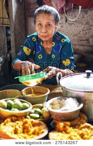 Yogyakarta, Indonesia. December, 15 2018. Jamu Seller Or Herbalist In Traditional Market, Prawirotam