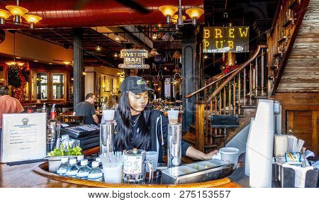 New Orleans, Usa - Dec 4, 2017: Young Lady Preparing Drinks In An Outside Bar Along Decatur Street, 