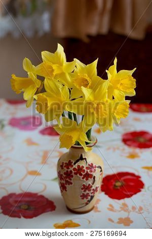 Bouquet Of Yellow Daffodils In A Vase On The Table.