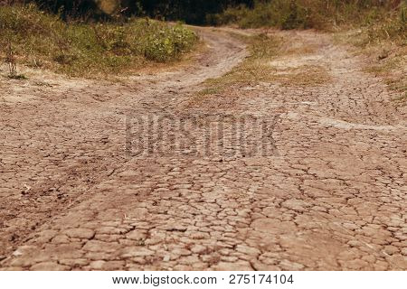 The Dry Road In Cracks In Rural Areas With Droughty Climate In The Summer