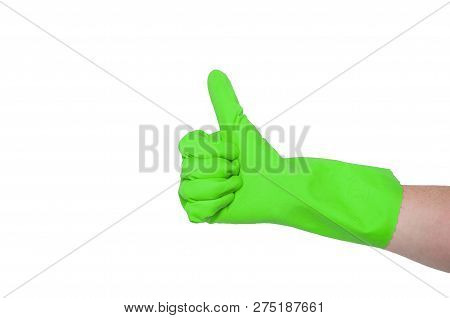 Green Glove For Cleaning On A Female Hand Shows Thumb Up. The Concept Of Cleanliness.