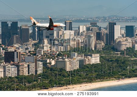 Rio De Janeiro, Brazil - November 23, 2018: Gol Airlines Aircraft Is Flying Above Rio De Janeiro Cit