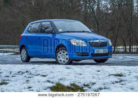 Blu Skoda Fabia To Street, Trees An Way. Winter, Travel Photo 2012.