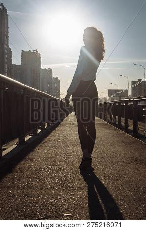 Girl On The Road At Sunset In Summer