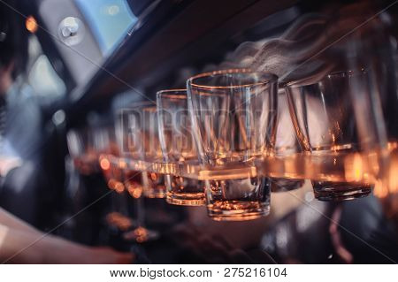 A Row Of Glasses Stands In A Row On The Holder