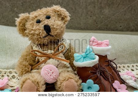 Toy Bear With Small Brown Shoes And Cute Holiday Decor.