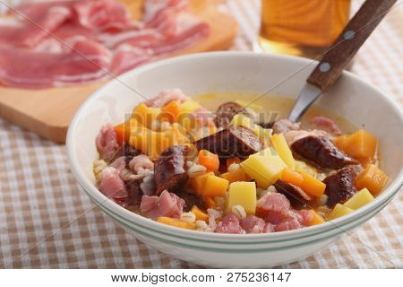Traditional Irish dish Dublin coddle with sausages on a table